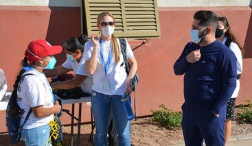 Ann Cheney with a student and a member of the promotores at a recent free clinic.